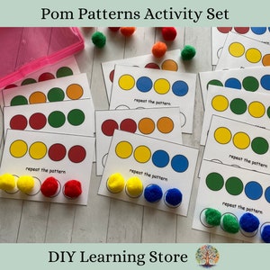 May include: A set of colorful pom pom pattern cards for kids. The cards have different color patterns and the text "repeat the pattern".