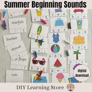 May include: Educational cards with summer-themed images and words, including a starfish, bucket, and sun. The cards are designed to teach beginning sounds, with letters and spaces for spelling. The text "Summer Beginning Sounds" is at the top.