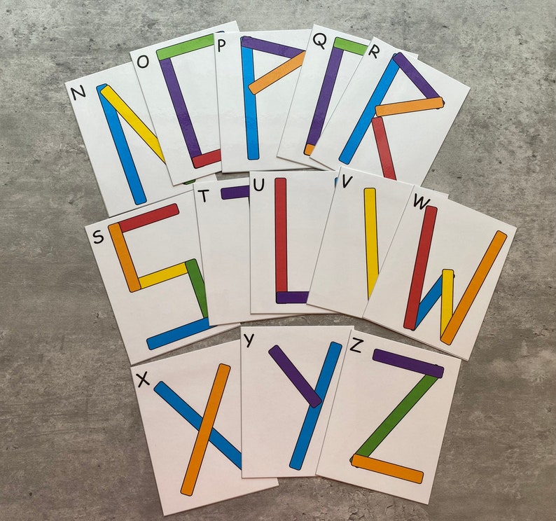 May include: A set of alphabet letter flashcards with colorful lines forming the letters. The letters are N, O, P, Q, R, S, T, U, V, W, X, Y, and Z.
