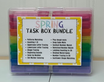 May include: A clear plastic storage box with colorful compartments. The box is labeled "SPRING TASK BOX BUNDLE" and lists activities for preschoolers, such as "Patterns Matching", "Counting 1-12", "Play Dough Mats", and "Snap Cube Mats".