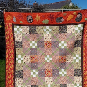 Handmade Patchwork autumn quilt with hedgehogs