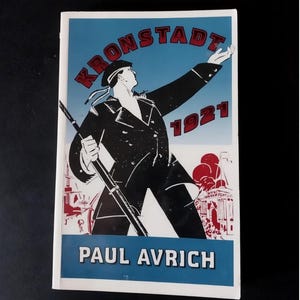 May include: A book cover with a vintage illustration. The image features a figure in a sailor's uniform reaching upwards, with the word "KRONSTADT" above and "1921" in red. The author's name, "PAUL AVRICH," is at the bottom.