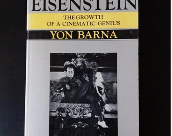 May include: A book titled "EISENSTEIN" with the subtitle "THE GROWTH OF A CINEMATIC GENIUS" by Yon Barna. The cover features a black and white photograph of a man seated on a decorative chair. The book has a gray cover with yellow and black text.
