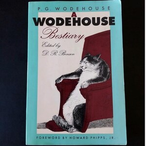May include: A book titled A Wodehouse Bestiary edited by D. R. Bensen with a foreword by Howard Phipps, Jr. The cover features a black and white illustration of a cat sitting in a dark red armchair against a light blue and white background.
