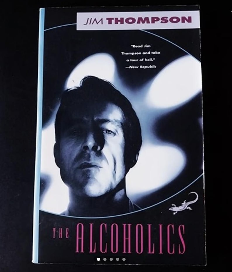 May include: A book cover with a black and white photo of a man with a serious expression. The title of the book is "THE ALCOHOLICS" in pink letters. The author's name, "JIM THOMPSON", is printed in white letters at the top of the cover.
