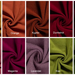 May include: A swatch card showing ten different fabric colors. The colors are mustard yellow, orange, copper, dark red, burgundy, pink, magenta, lavender, kiwi green, and hunter green.