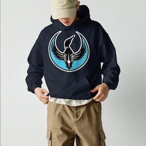 May include: A set of three ceramic mugs with a speckled, matte finish. Each mug features a different color: light blue, cream, and gray. The mugs have a simple, modern design and a comfortable handle.