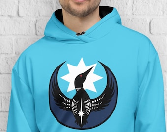 May include: A light blue hoodie with a black and white graphic of a bird inside a crescent moon and star design. The hoodie has a front pocket and a black lined hood. The person is wearing dark pants.