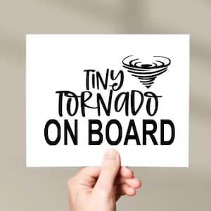 May include: White card with black text that reads "Tiny Tornado On Board" with a black silhouette of a tornado above the text.