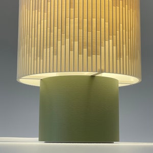 a close up of a lamp that is on top of a table