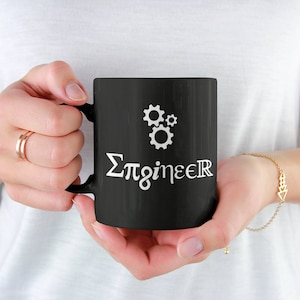 May include: Black ceramic coffee mug with a white design that says "Σπgineer" with a graphic of three interlocking gears.