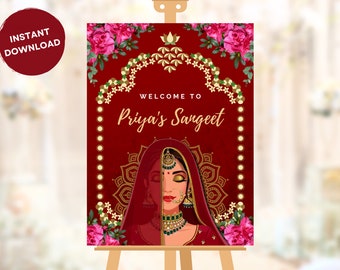 May include: A red and gold welcome sign with a floral design and a woman in a red veil. The sign says "Welcome to Priya's Sangeet".