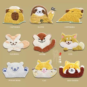 May include: Embroidered patches featuring various animals, including a capybara, sloth, squirrel, otter, fox, polar bear, cat, and red panda. Each patch showcases detailed stitching and vibrant colors, perfect for adding to clothing or accessories.