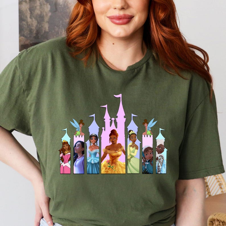 a woman with red hair wearing a disney princess t - shirt