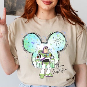 a woman with red hair wearing a mickey mouse shirt