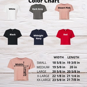May include: Color chart for women's crop tops in white, dark grey, desert pink, black, red, and midnight navy. The chart shows the width and length measurements for each size: small, medium, large, x-large, and xx-large.