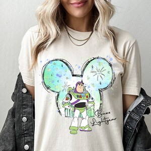 a woman wearing a mickey mouse t - shirt