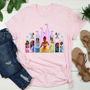 a t - shirt with a picture of princesses on it