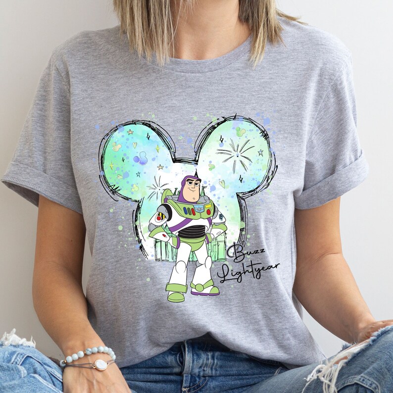 a woman wearing a gray disney mouse shirt