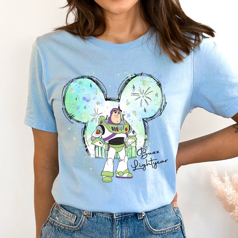 a woman wearing a blue disney mouse shirt