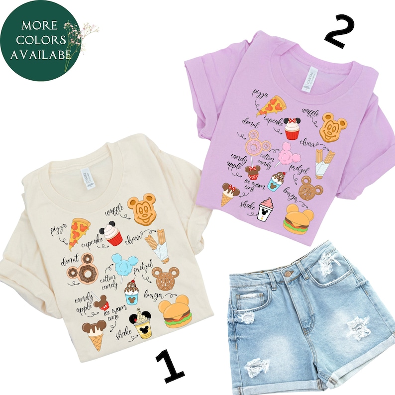 May include: Two t-shirts with a light beige and a light purple background. Both shirts feature a variety of Disney-themed food items, including pizza, donuts, churros, pretzels, ice cream, and Mickey Mouse ears. The shirts are numbered 1 and 2.
