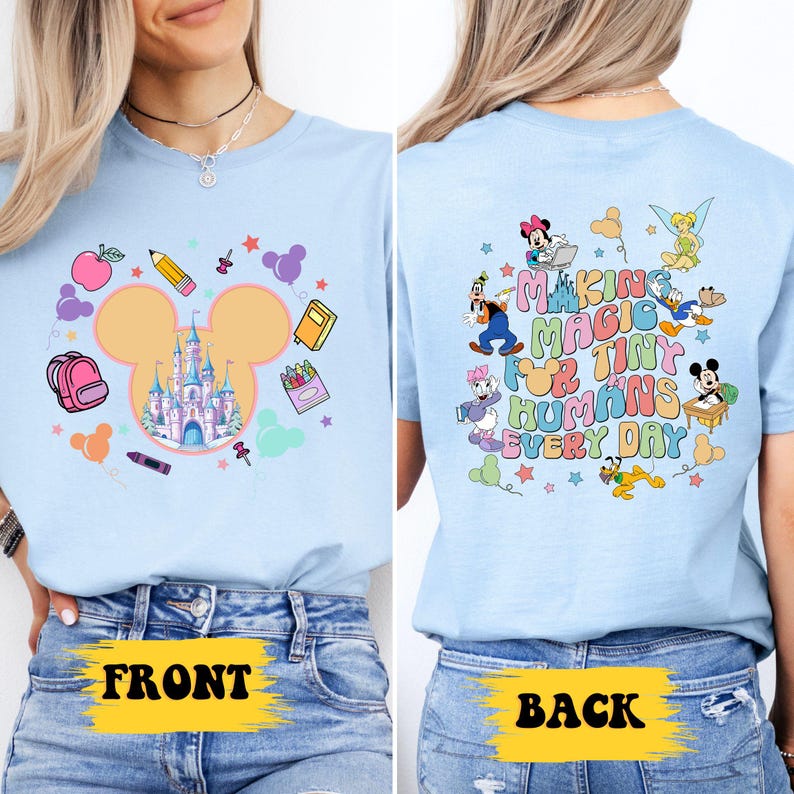 a woman wearing a blue shirt with mickey mouse on it