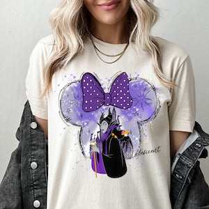 a woman wearing a mickey mouse tshirt