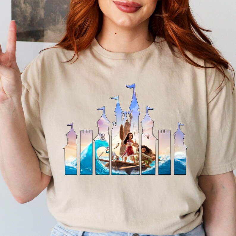 a woman wearing a t - shirt with a picture of a woman on a boat