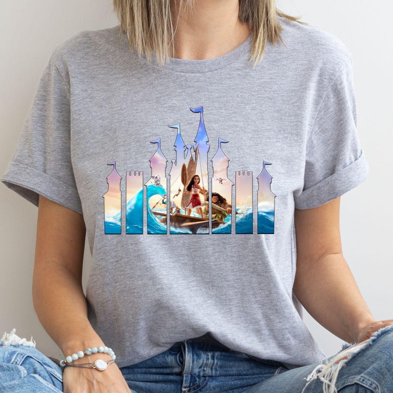 a woman wearing a t - shirt with a picture of a woman in a boat