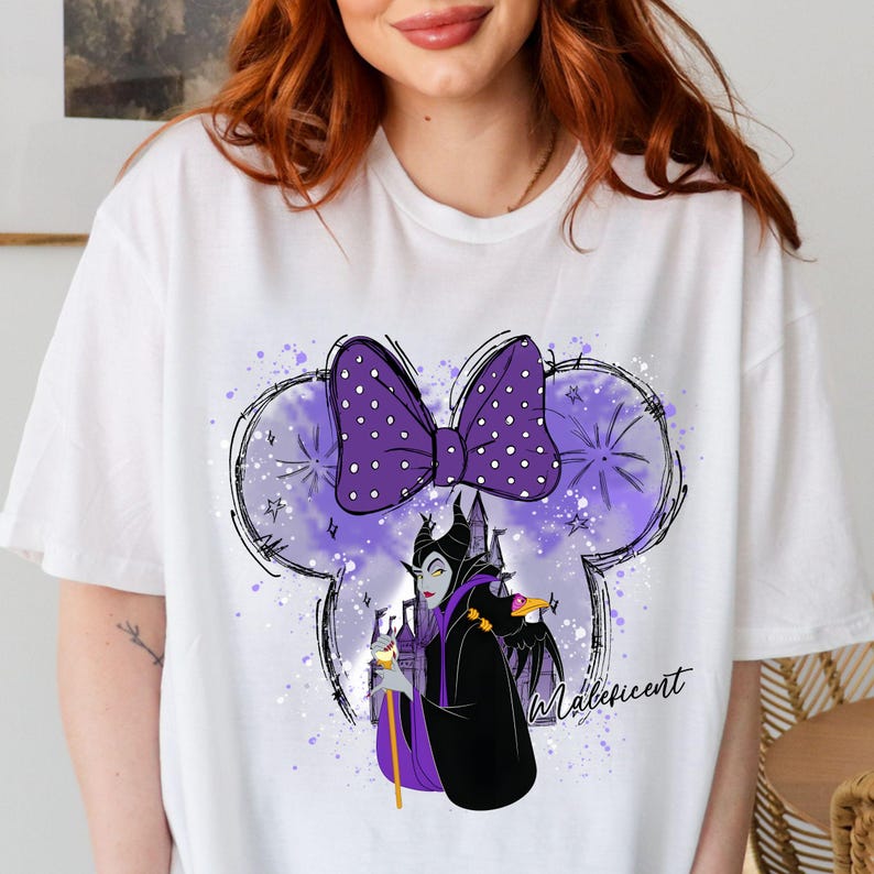 a woman with red hair wearing a white t - shirt with a purple minnie mouse