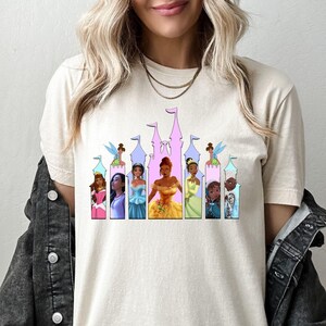 a woman wearing a disney princess t - shirt