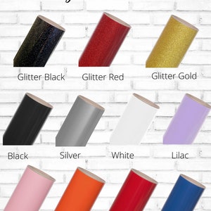 May include: Color chart showing different vinyl colors for crafting projects. The colors include glitter black, glitter red, glitter gold, black, silver, white, lilac, light pink, orange, red, and royal blue.