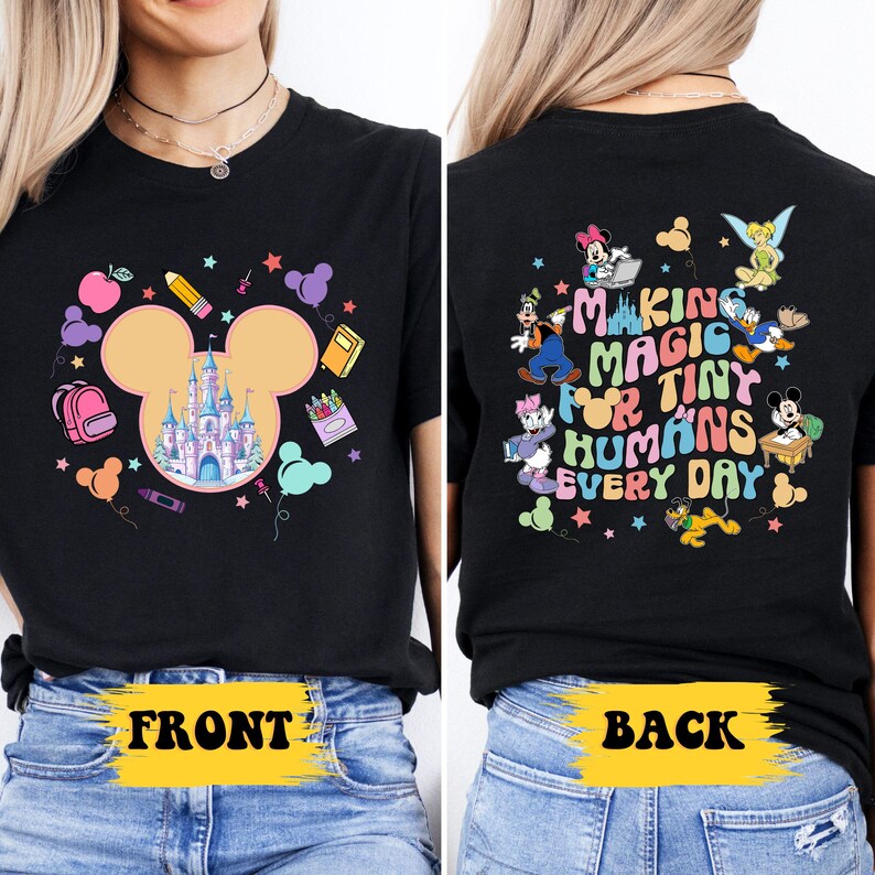 a woman wearing a black mickey mouse shirt
