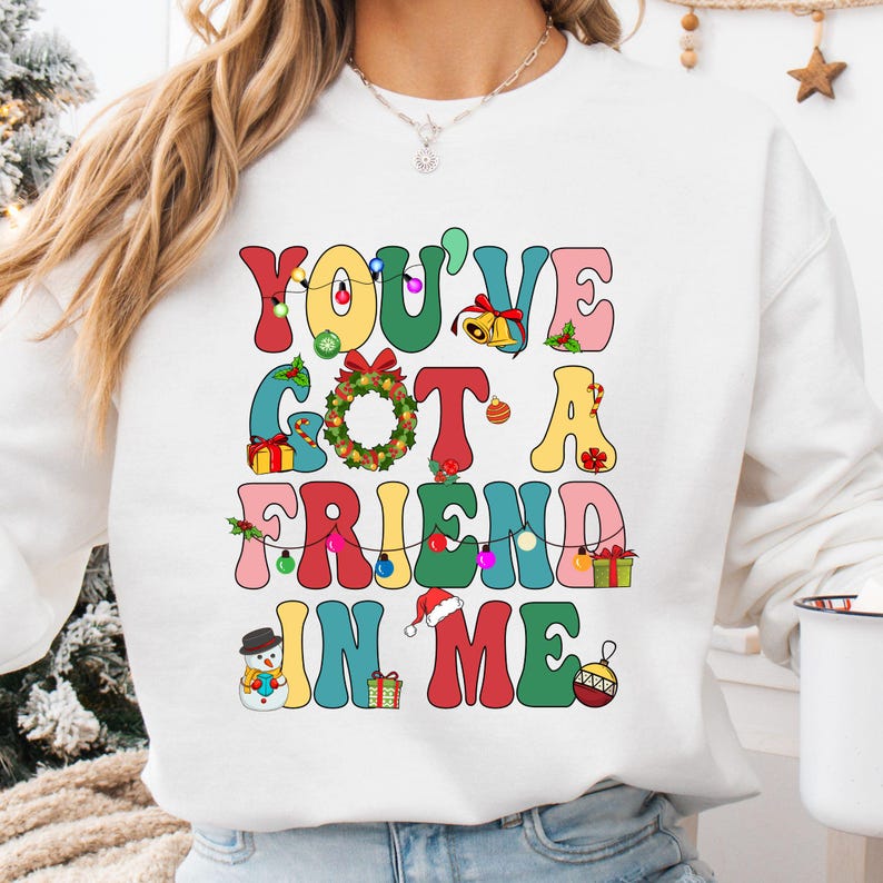 a woman wearing a sweatshirt that says you've got a friend in me