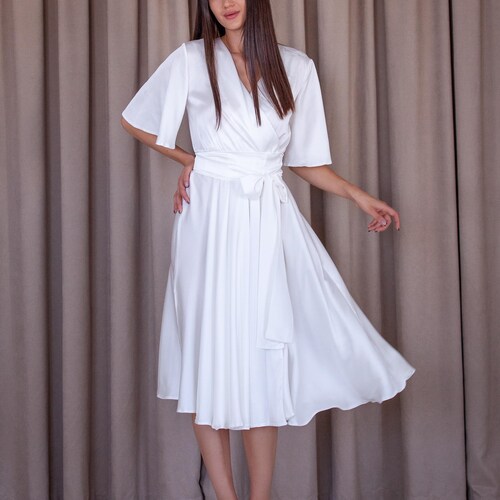 White Silk Wrap Dress with A-line Silhouette and Butterfly Sleeves for Bridal or Engagement Parties White Silk Wrap Dress with A-line Silhouette and Butterfly Sleeves for Bridal or Engagement Parties
