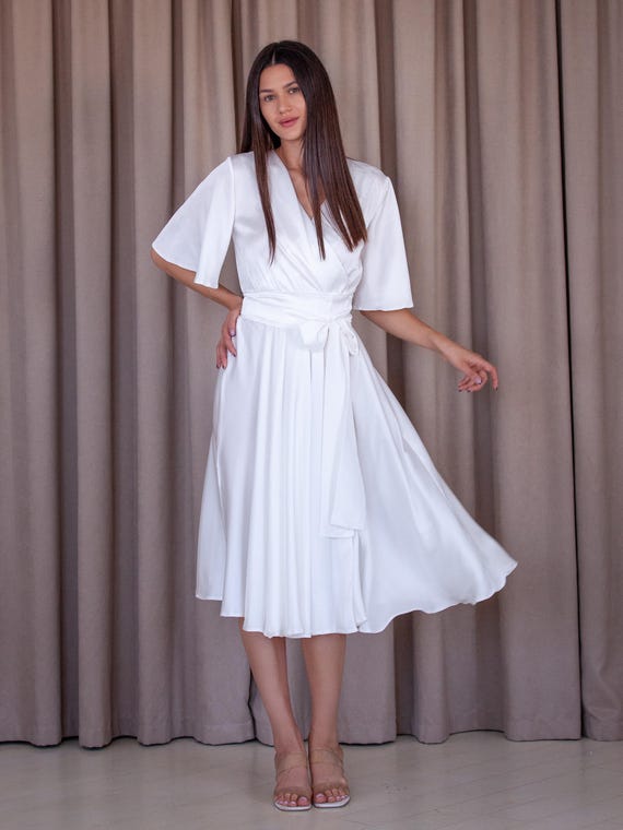 green emerald velvet dress Voyager Linen Wrap Dress in White main image 0