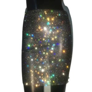 May include: A short black skirt with a sparkly iridescent design. The skirt is made of a mesh fabric with small rhinestones.