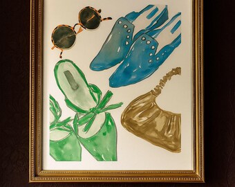 May include: Watercolor painting of fashion accessories including sunglasses, blue loafers, green heels, and a gold handbag. The items are arranged on a white background within a gold frame.