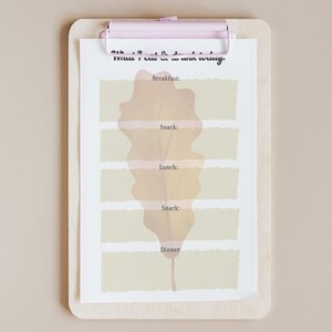 May include: A printable meal planner with a fall-themed leaf design. The planner has sections for breakfast, snack, lunch, snack, and dinner.