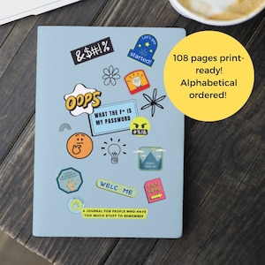 May include: A blue journal with colorful stickers on the cover. The stickers include phrases like "Oops", "What the F is my password", and "Welcome". The journal has 108 pages and is alphabetically ordered.