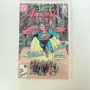 May include: A comic book cover featuring Superman flying over a city skyline. The cover is titled "Action Comics" and features the text "Good-bye, Superman! We'll miss you!"
