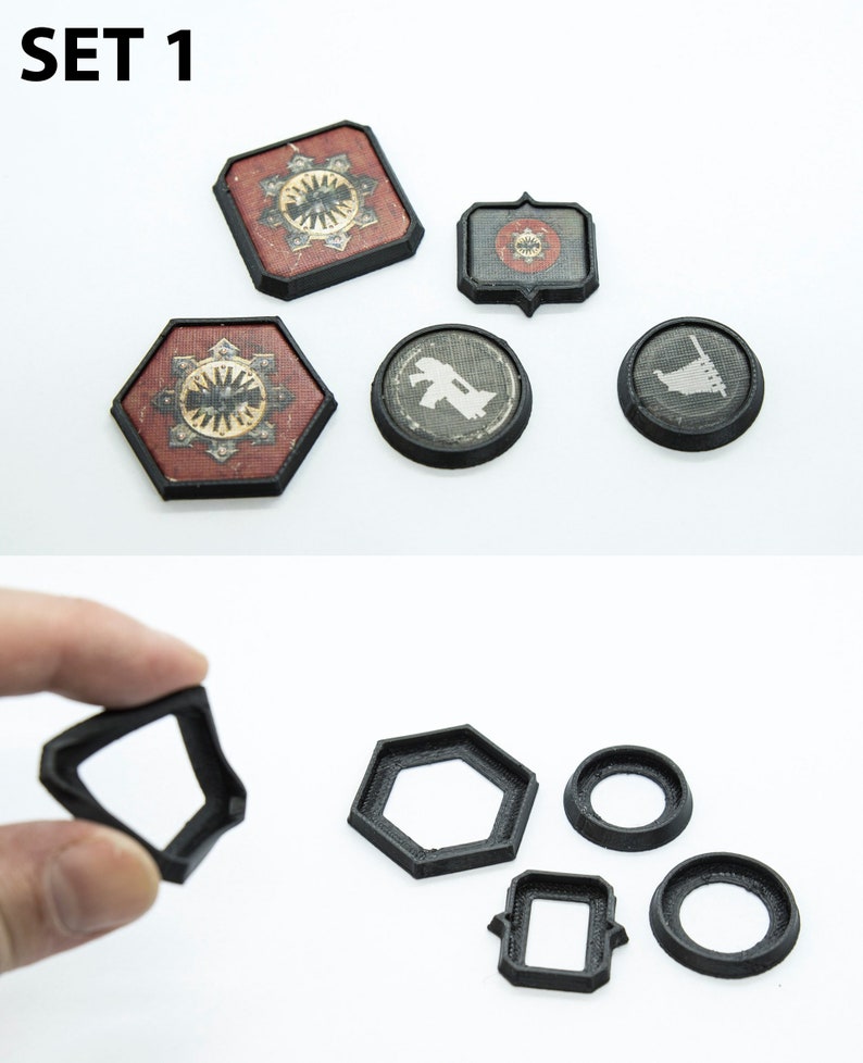 May include: Set of six black plastic game pieces, including a square, hexagon, circle, and two rectangles. The pieces are designed to be used as bases for miniature figures in a tabletop game.