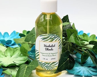 May include: A clear glass bottle with a white spray top filled with a yellow liquid. The bottle has a white label with green leaves and the text "Herbalist Blends Peppermint & Magnesium Natural Body Blend 2 fl. oz (59ml)"
