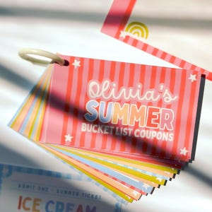 May include: A set of rectangular paper coupons held together by a white plastic ring. The top card features pink vertical stripes, white stars, and the text Olivia's SUMMER BUCKET LIST COUPONS. Additional cards in blue, yellow, and orange are visible.
