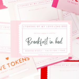 May include: Pink and white love coupon with the text "TOKENS OF MY LOVE NO.002" and "Breakfast in bed". The coupon is valid for one year.