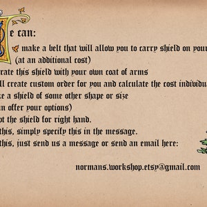 May include: A parchment-toned card with ornate calligraphy and illustrations. The text details custom shield options, including belt attachments, coat of arms decoration, and size variations. A tree with a shield bearing a lion crest is in the lower right.