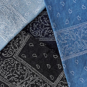 May include: Three fabric swatches with paisley patterns. The swatches are blue, black, and a lighter shade of blue.