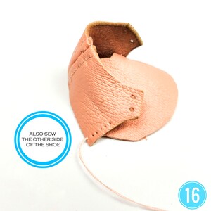 May include: A close-up of a partially assembled peach-colored leather shoe. The shoe's components are stitched together with a light pink thread. The text "ALSO SEW THE OTHER SIDE OF THE SHOE" is in a blue circle. The number "16" is in the bottom right corner.