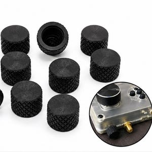 May include: Black, knurled control knobs for ham radio accessories. The knobs have a diamond pattern on the sides and a flat top. The Signal Mods logo is in the upper left corner.