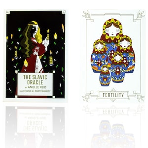 Bright blue, red, green and yellow Matryoshka dolls, Russian nesting dolls are on a card labeled Fertility next to the guidebook of The Slavic Oracle.